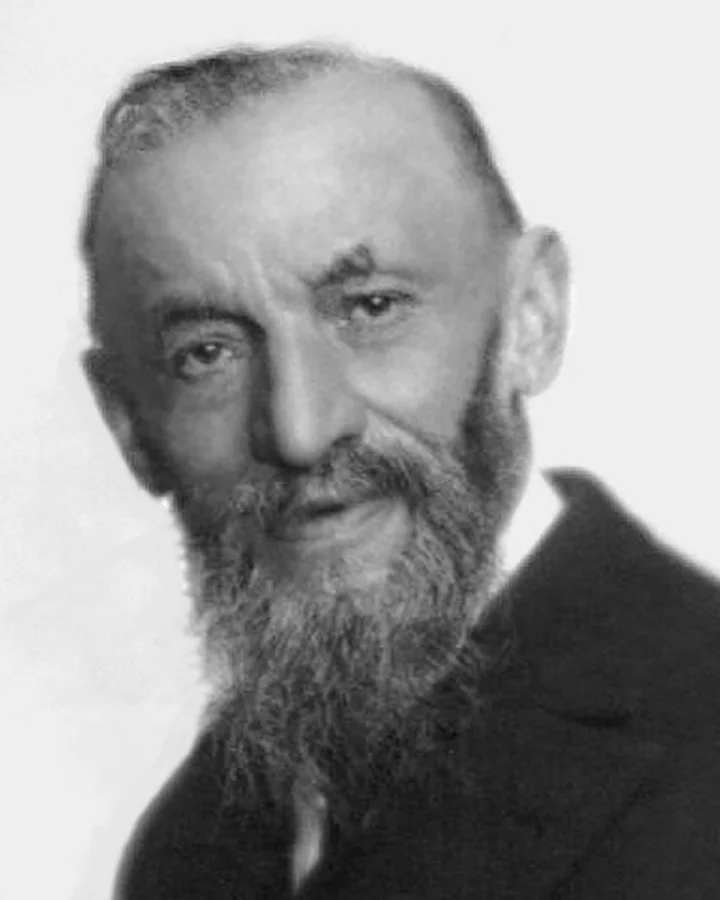 Historical black-and-white portrait of Giuseppe Peano